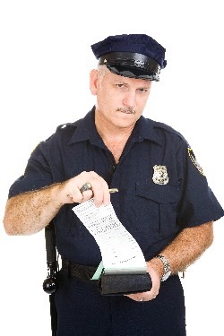 officer_w_cap_writing_ticket_250h.jpg